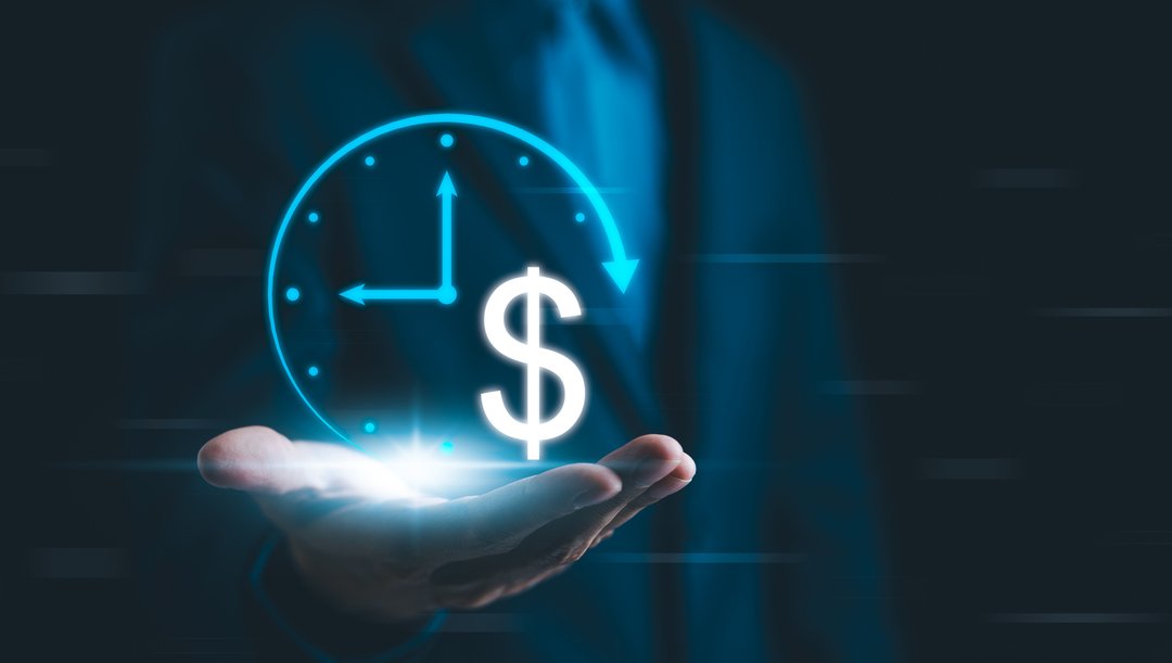 Man holding holographic clock and dollar sign representing long-term finance