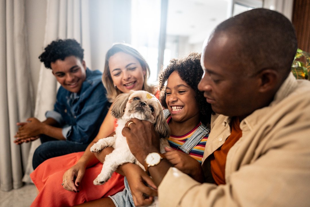 Family gathered around the family dog