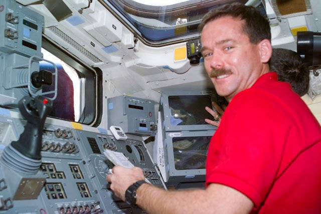 s74e5002-sts-074-astronaut-chris-hadfield-at-rms-controls-713c86
